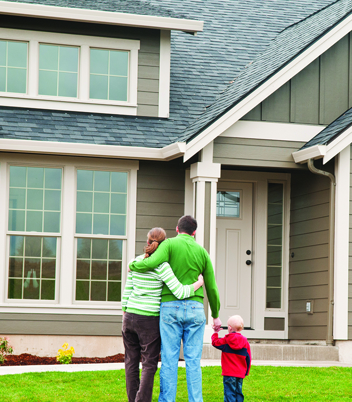 a person standing in front of a house